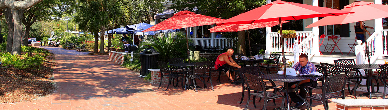 People dining outside a restaurant in Henry C. Chambers Waterfront Park in Beaufort, SC USA